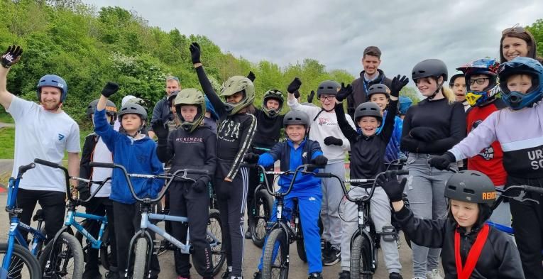 Children on BMX's cheering