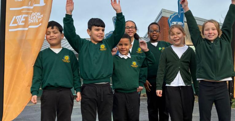 Children looking happy and energetic in their newly painted playground