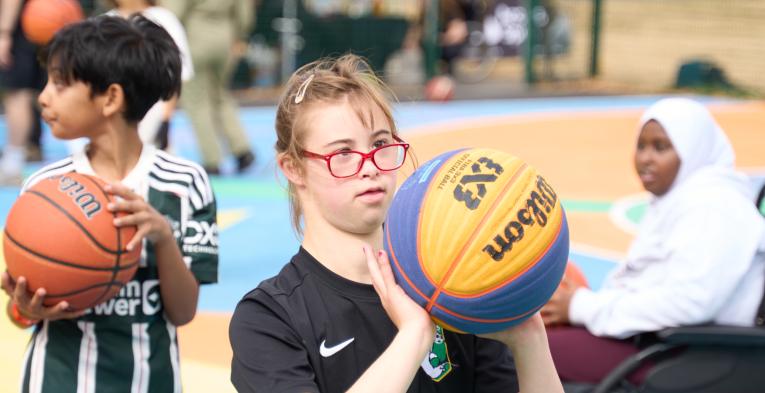 Young people with disabilities playing basketball 