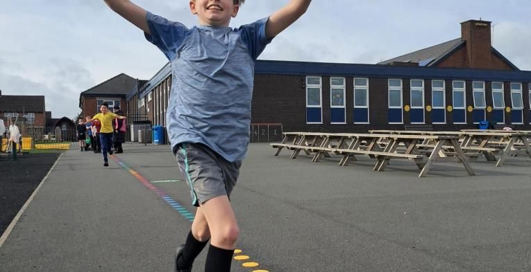 Boy running on his new Active Playground