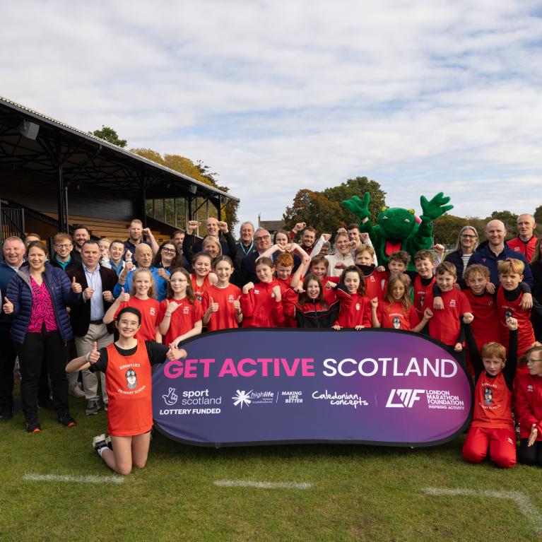 A group photo of funders, stakeholders, Olympian Megan Keith and primary school pupils at the launch of Get Active Scotland in Bught Park, Inverness
