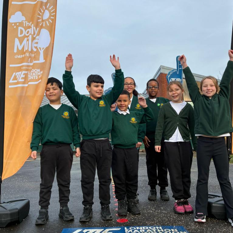 Children looking happy and energetic in their newly painted playground