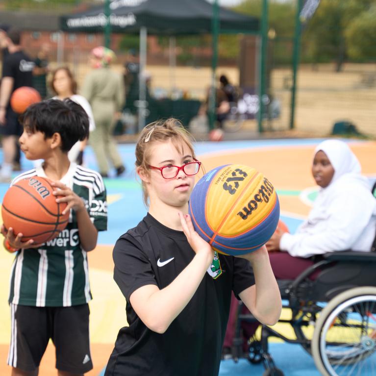 Young people with disabilities playing basketball 