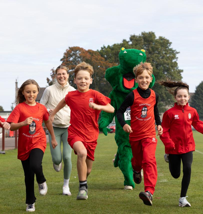 Pupils running with Olympian Megan Keith